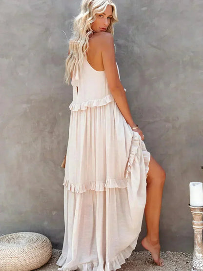 Robe longue femme sans manches, en voile léger, avec volants superposés pour un style aérien et décontracté.
