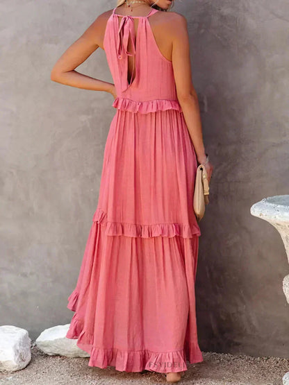 Robe longue femme sans manches, en tissu léger, avec volants superposés pour un style fluide et élégant.