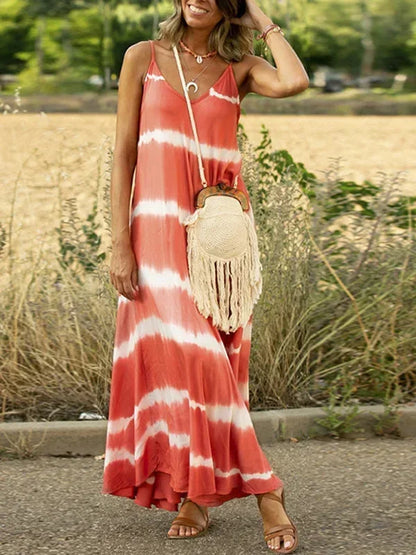 Robe longue sans manches en tissu léger tie-dye, col en V, offrant une coupe ample et confortable pour les journées d'été.
