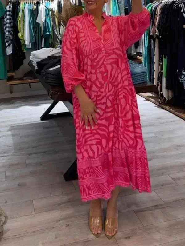 Robe longue fluide pour femme, à manches longues, col en V, en tissu léger avec un imprimé floral coloré.