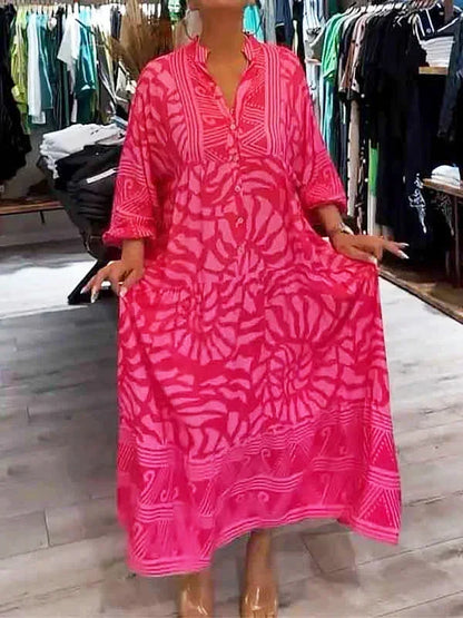 Robe longue fluide en polyester, imprimée, manches longues, col en V, idéale pour une allure décontractée et élégante.