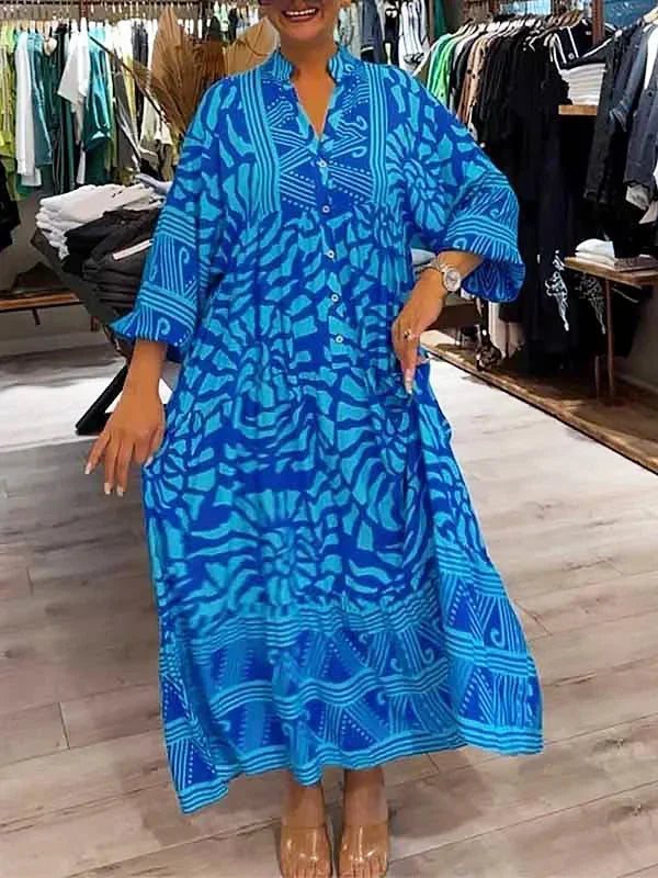 Robe longue fluide bleu avec manches longues, col en V, imprimée, idéale pour des journées confortables en toute élégance.