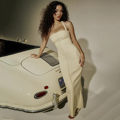Robe longue ajustée sans manches en coton stretch, avec fermeture zippée au dos et coupe flatteuse pour un confort optimal.