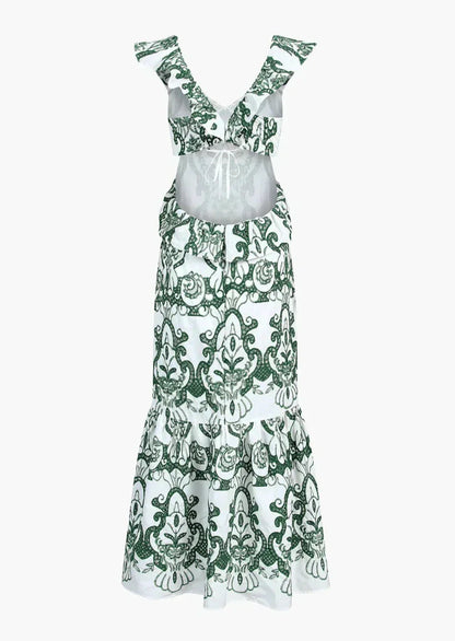 Robe longue blanche et verte à volants, en coton léger, avec un dos noué pour un style estival décontracté.
