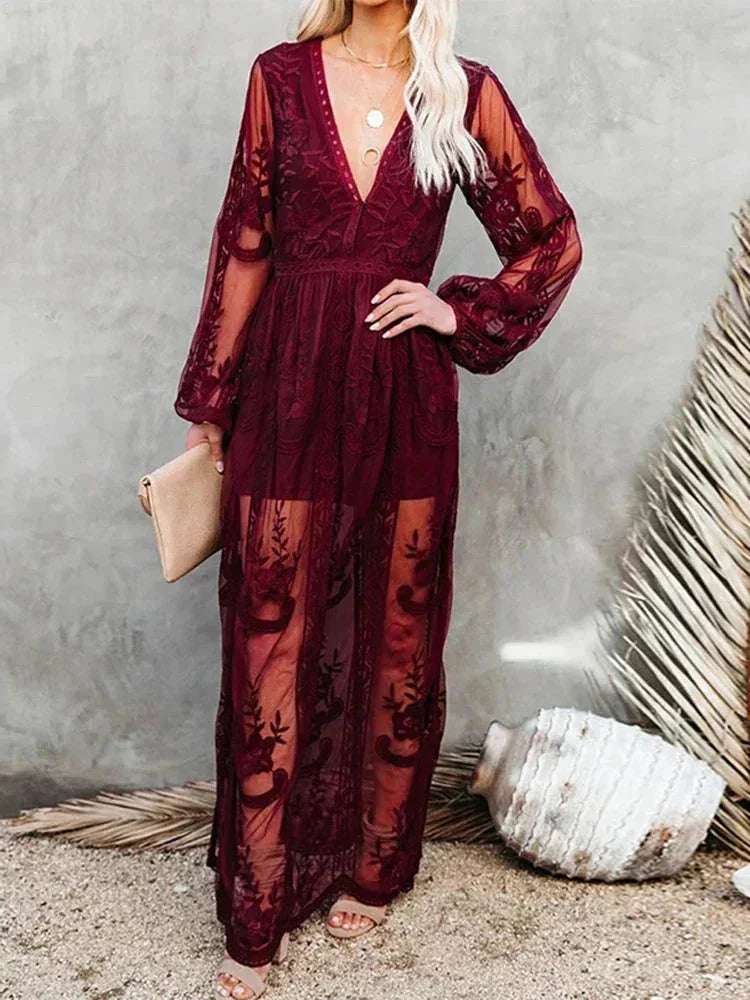 Robe longue en dentelle transparente, manches longues, col en V, avec un design élégant pour des soirées.