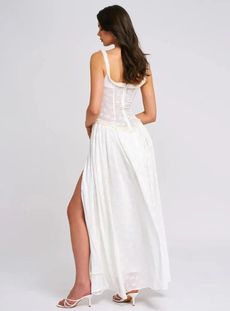 Robe maxi femme à bretelles, en coton léger, avec une fente haute pour un style fluide et élégant.