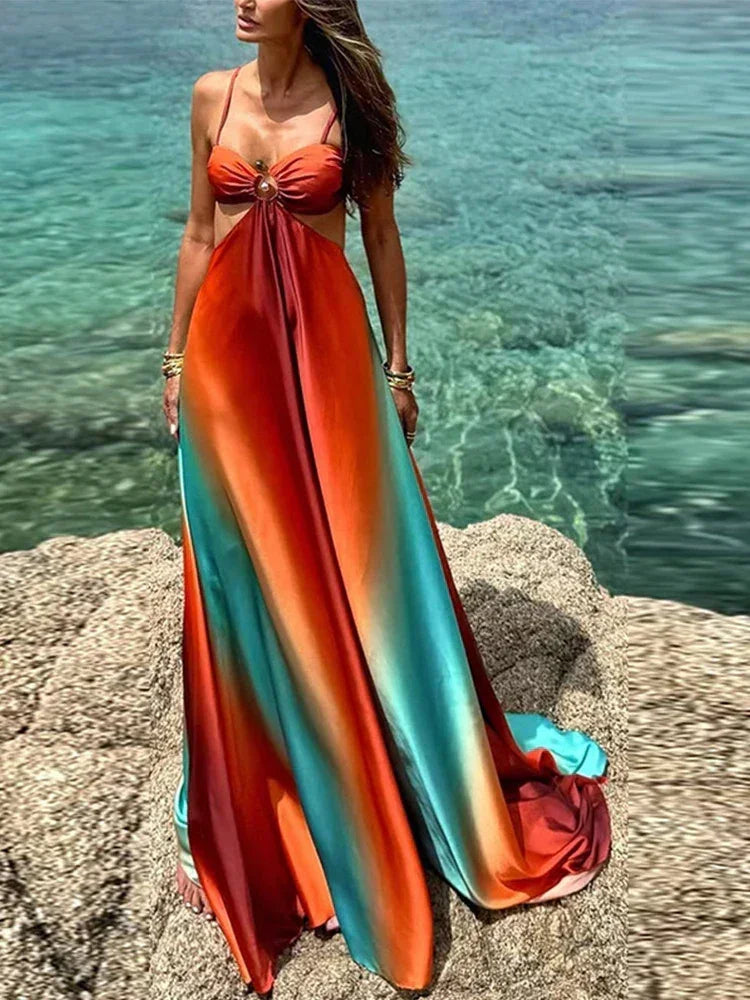 Robe maxi femme en tissu léger, dégradé orange et turquoise avec découpes modernes et fluide pour un look décontracté.