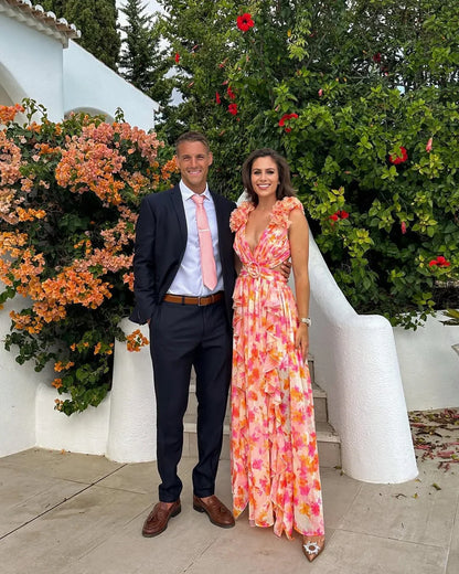 Robe maxi femme fleurie sans manches en coton léger, avec un motif floral délicat et une coupe fluide.
