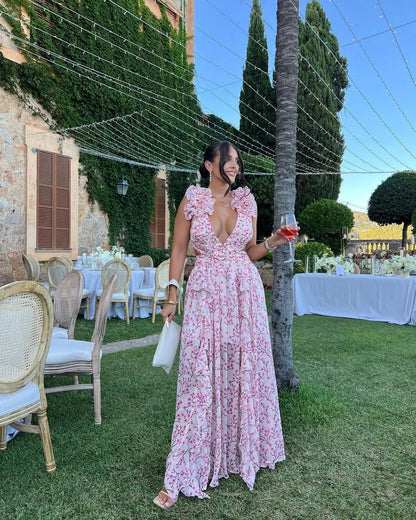 Robe maxi femme fleurie sans manches en coton léger, avec un design floral coloré et une coupe fluide pour l'été.