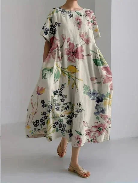Robe maxi femme en tissu léger, motif floral, ample avec manches courtes et poches, idéale pour l'été en prairie.