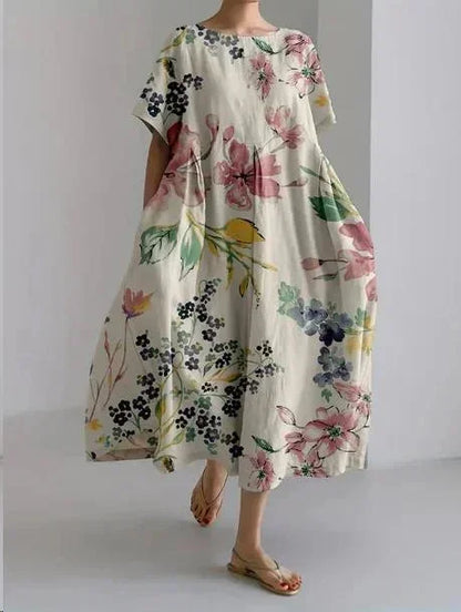 Robe maxi femme en tissu léger, motif floral, ample avec manches courtes et poches, idéale pour l'été en prairie.
