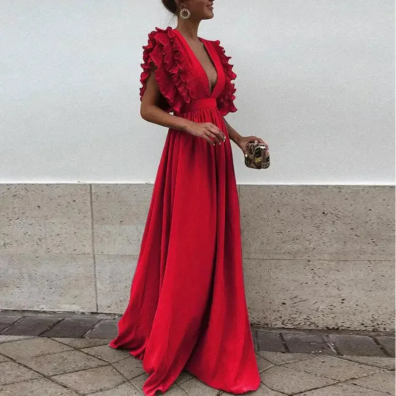 Robe longue femme en tissu fluide, manches volantées, décolleté plongeant, idéale pour une silhouette élégante et confortable.