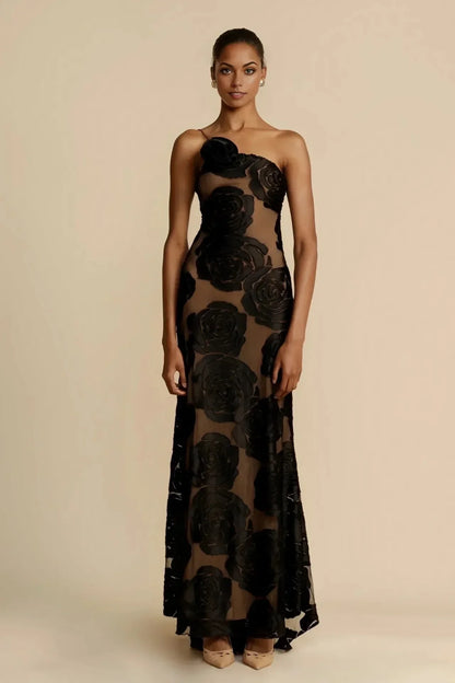 Robe maxi noire pour femme, en coton léger, ornée de motifs floraux colorés sur un tissu fluide et élégant.