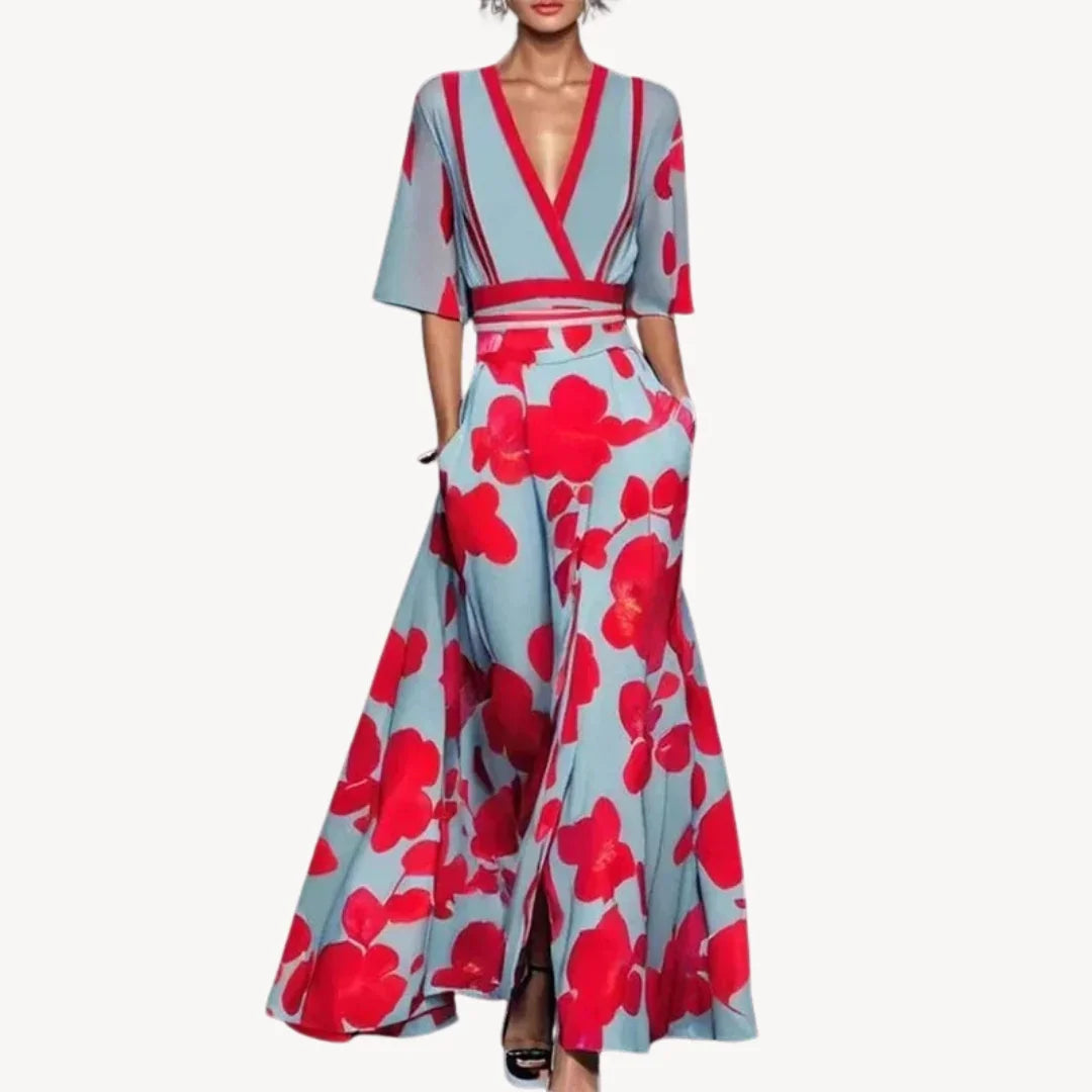 Robe longue fluide en viscose, manches mi-longues, bordure contrastée, pratiques poches intégrées.