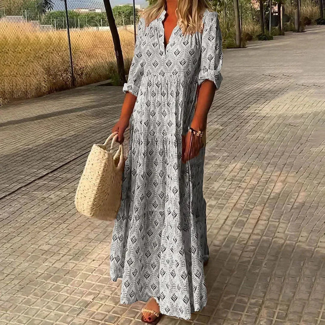 Robe longue à motifs avec manches longues, col V, en coton léger, idéale pour les journées d'été ensoleillées.