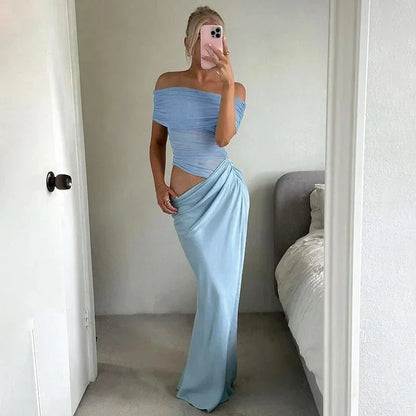 Robe longue en tissu fluide, épaules dénudées, taille froncée avec découpe, parfaite pour des occasions décontractées.
