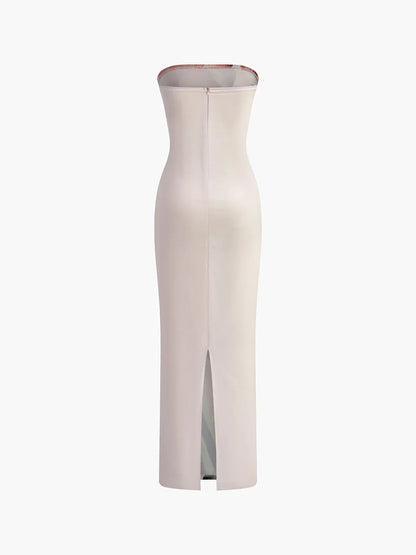 Robe longue sans bretelles en tissu léger, à motif floral orangé, parfaite pour les soirées d'été.