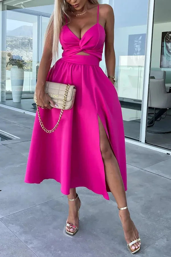 Robe midi en coton avec découpes, poches latérales et fente longue, idéale pour un look décontracté.