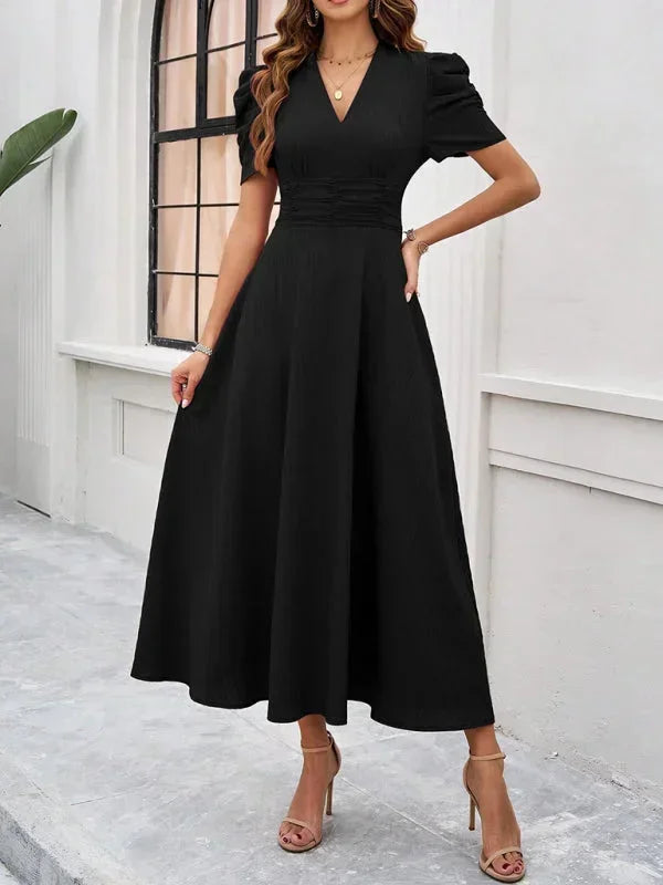 Robe midi femme en tissu léger, col V, manches bouffantes et coupe fluide, idéale pour les occasions décontractées.