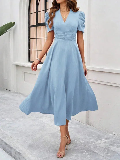 Robe midi femme en coton avec col V, manches bouffantes et imprime floral, idéale pour les sorties décontractées.
