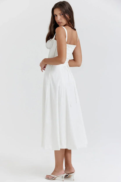 Robe midi femme en coton avec corsage froncé, manches courtes et jupe légère pour un look élégant et décontracté.