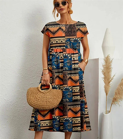 Robe midi orange en coton avec imprimé floral et poches, idéale pour une tenue décontractée au quotidien.