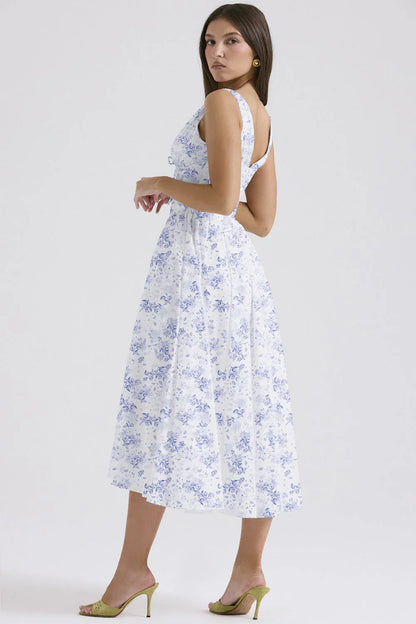 Robe midi femme fleurie sans manches en coton léger, avec un motif floral vibrant et une coupe fluide pour un confort…