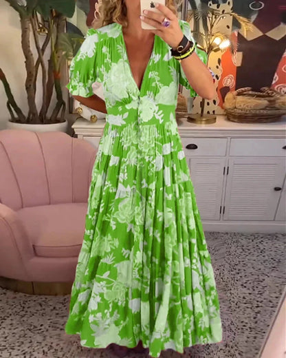 Robe midi femme vert à motifs floraux, manches courtes, tissu léger et respirant, idéale pour les jours ensoleillés.