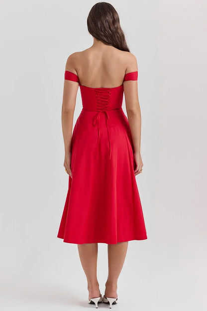 Robe midi fleurie à bretelles, en coton léger, avec fente latérale pour un style d'été décontracté et féminin.