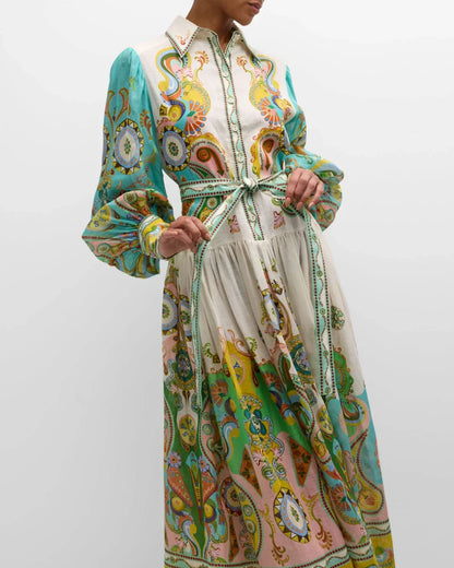Robe midi en tissu doux, imprimé cachemire, manches bouffantes, col chemise et ceinture assortie, idéale pour le printemps.