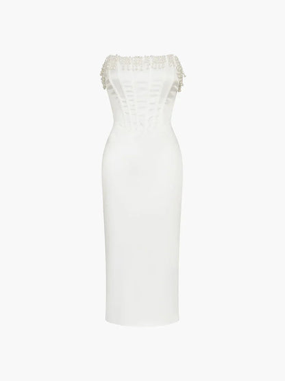 Robe midi ivoire en tissu léger, bustier perlée avec corset, idéale pour soirées et cocktails, style élégant et féminin.