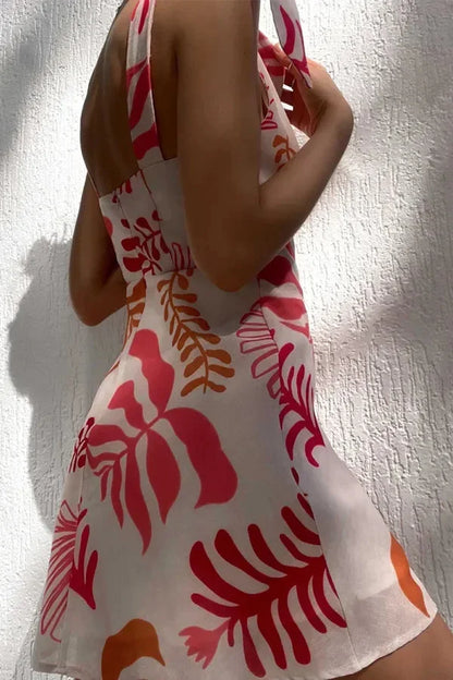Robe courte à impression de fleurs rouges, col V, nœud aux épaules, idéale pour les vacances d'été en coton léger.