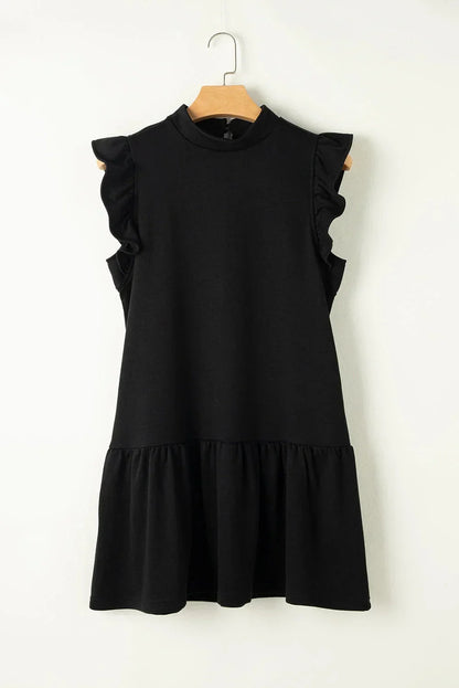 Robe courte noire à volants, manches courtes, coupe trapèze légère en tissu fluide, idéale pour les sorties en soirée.