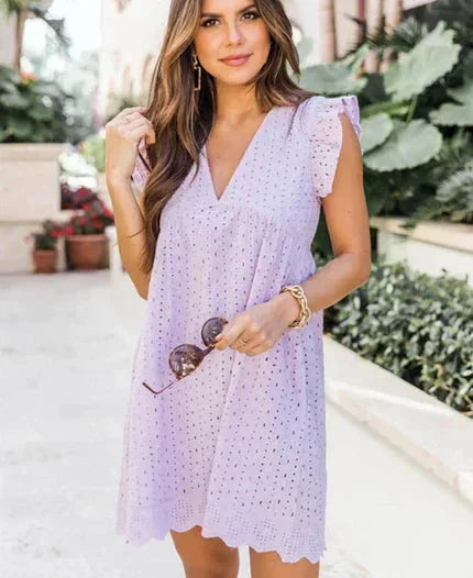 Robe courte sans manches en dentelle, légère, avec poches pratiques, idéale pour l'été et les journées à la plage.
