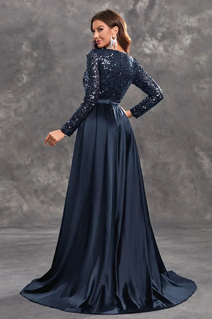 Robe soirée longue en tissu fluide, ornée de sequins brillants, avec une jupe évasée pour un look élégant et aérien.