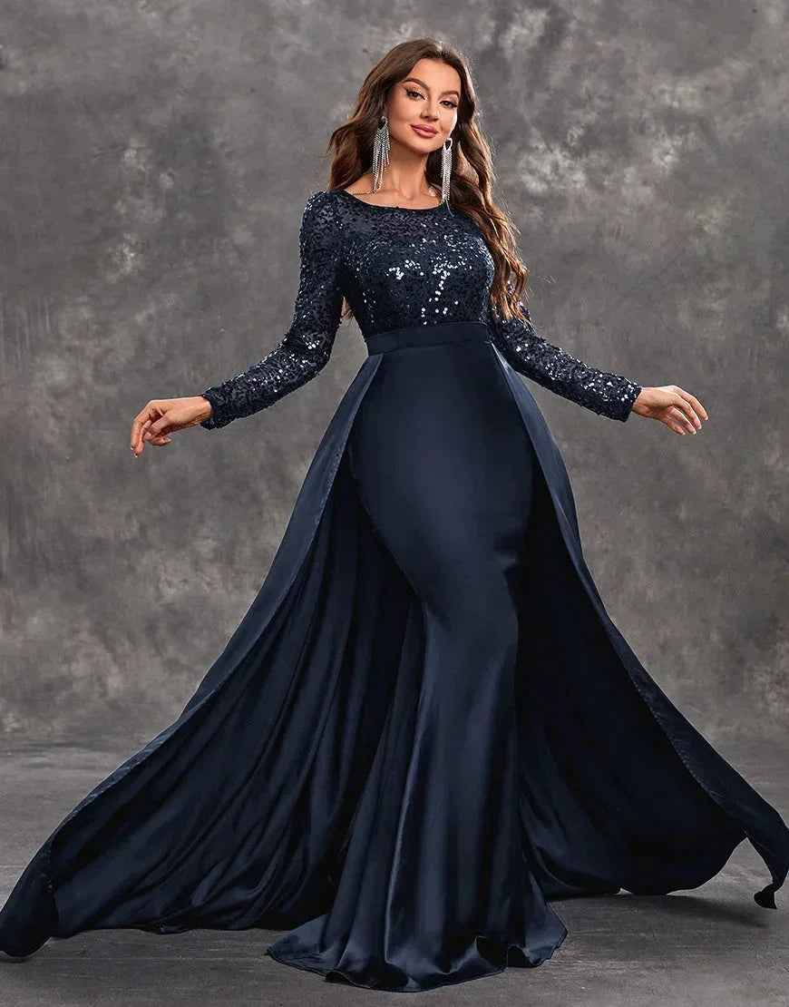 Robe longue soirée en tissu fluide, ornée de sequins, avec une jupe ample et légère pour une silhouette élégante.