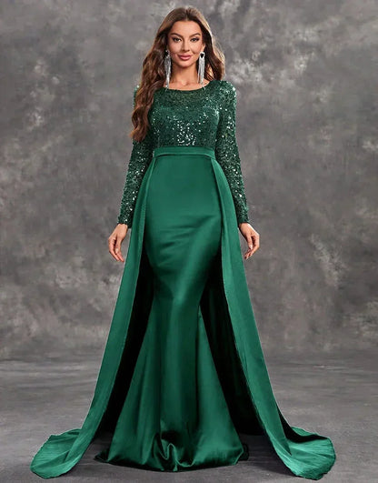 Robe soirée longue verte en satin avec sequins et jupe fluide, parfaite pour des occasions spéciales.