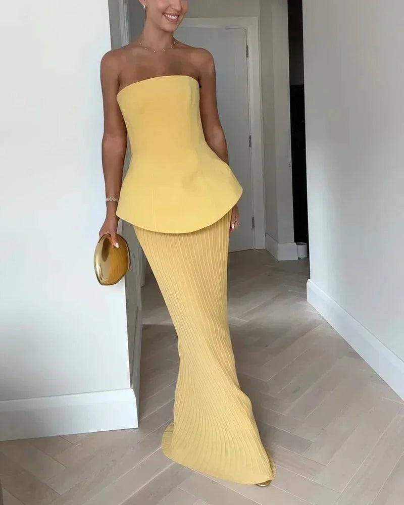 Top bustier jaune à basque en coton avec jupe côtelée, élégant design féminin pour un look raffiné et contemporain.