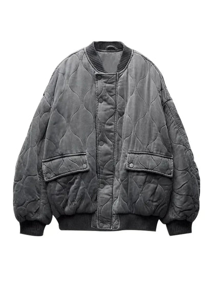 Veste bomber femme oversize matelassée gris avec boutons-pression, conçue pour un style décontracté.