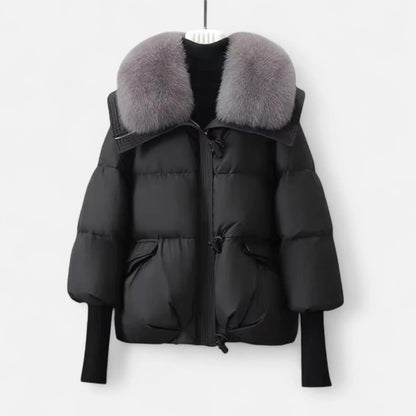 Veste femme noire avec col en fausse fourrure et manches côtelées, en tissu doux.