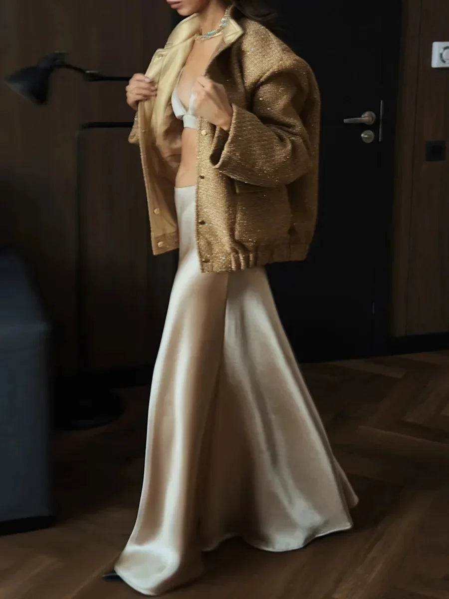 Veste femme à paillettes, coupe élégante, conçue pour les occasions festives et les cocktails.