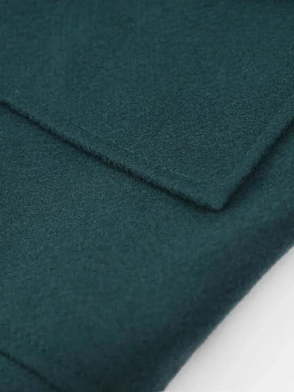 Veste femme vert foncé avec col en fausse fourrure et poches latérales pratiques.